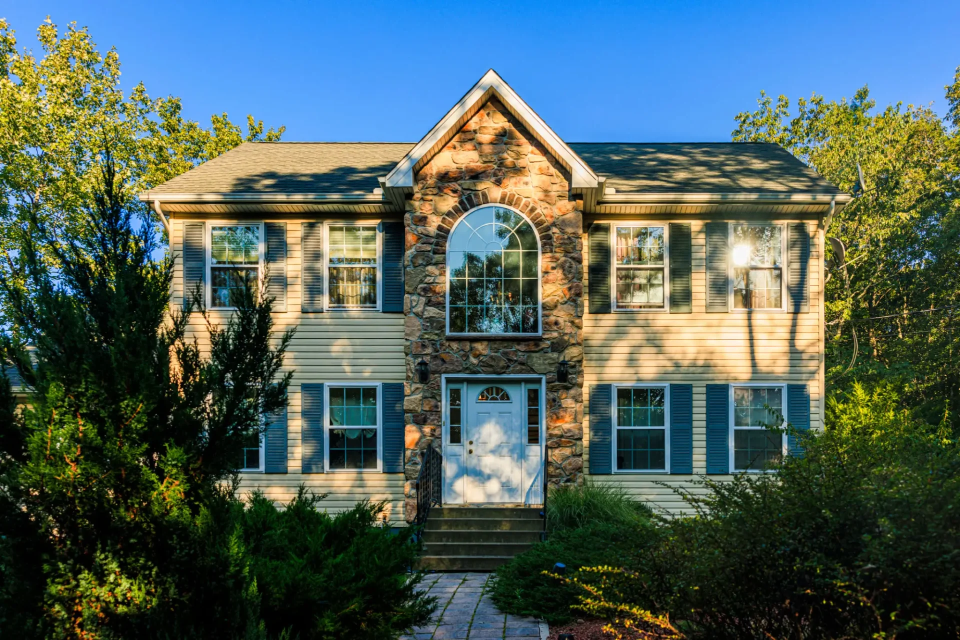 Suburban home surrounded by trees