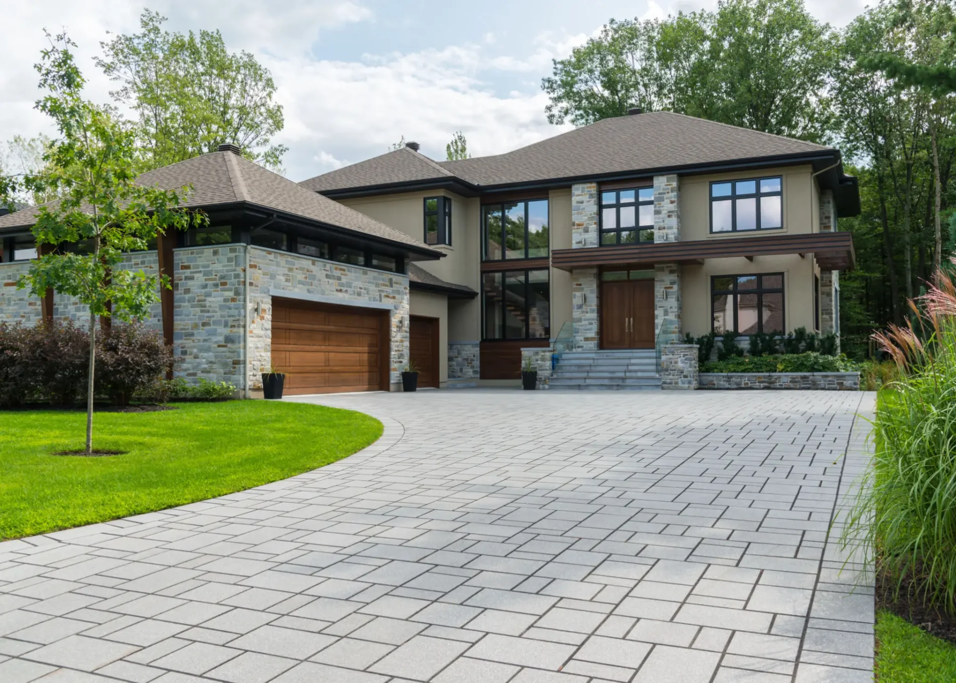 Modern house with stone facade and driveway